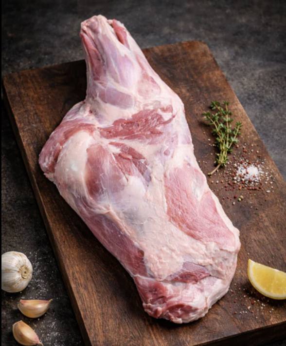 Fresh halal lamb leg on a cutting board