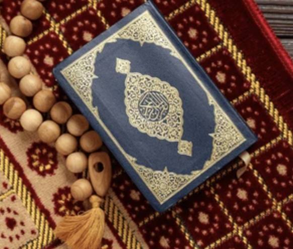 Quran, tasbih and prayer rug